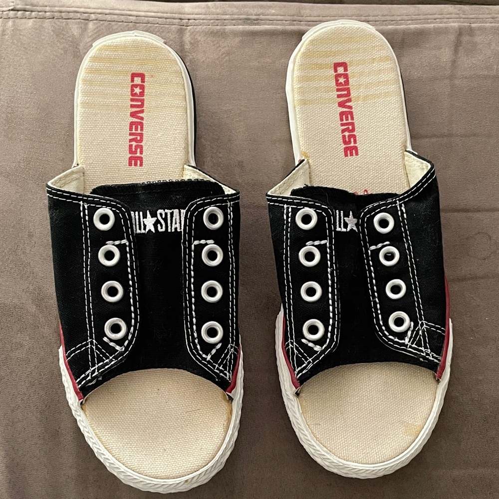 NWOB Converse Black Canvas cutaways Sneakers with White Eyelets.